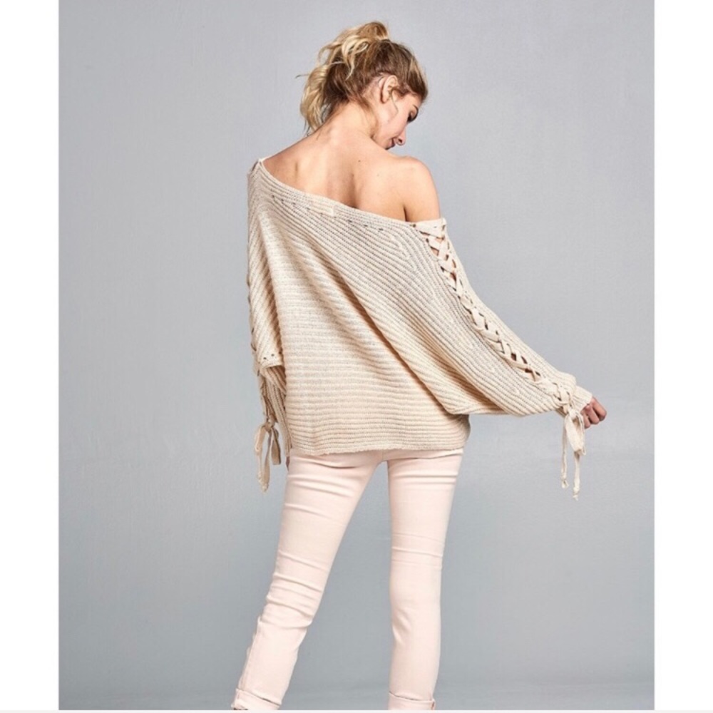 Off shoulder sweater with lace up detail